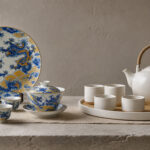 AI-reworked editorial comparison of Jingdezhen-style dragon porcelain and Japanese white ceramic tea ware with corrected vessel proportions.